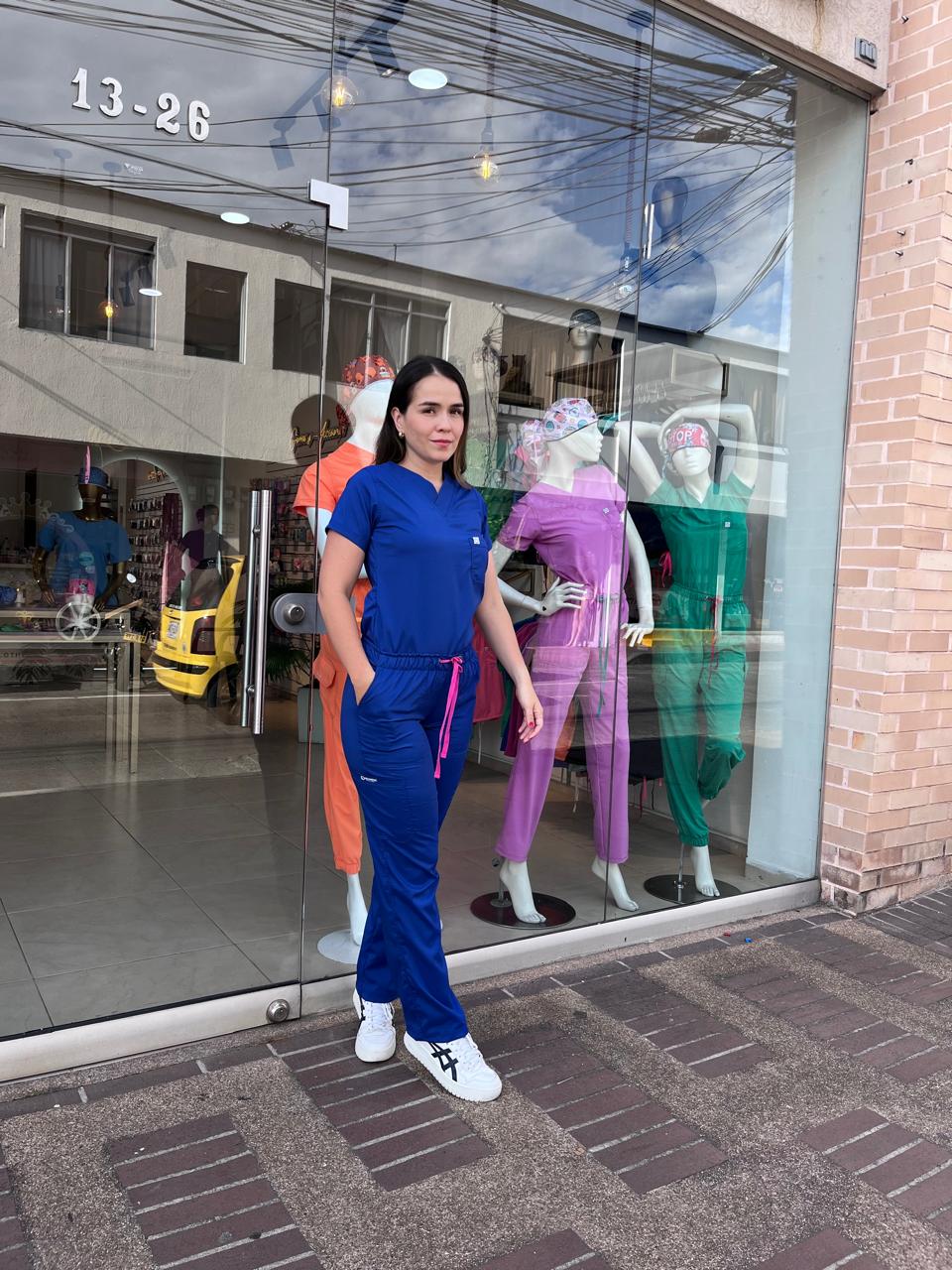 UNIFORME AZUL REY BOTA RECTA COMBINACION FUCSIA